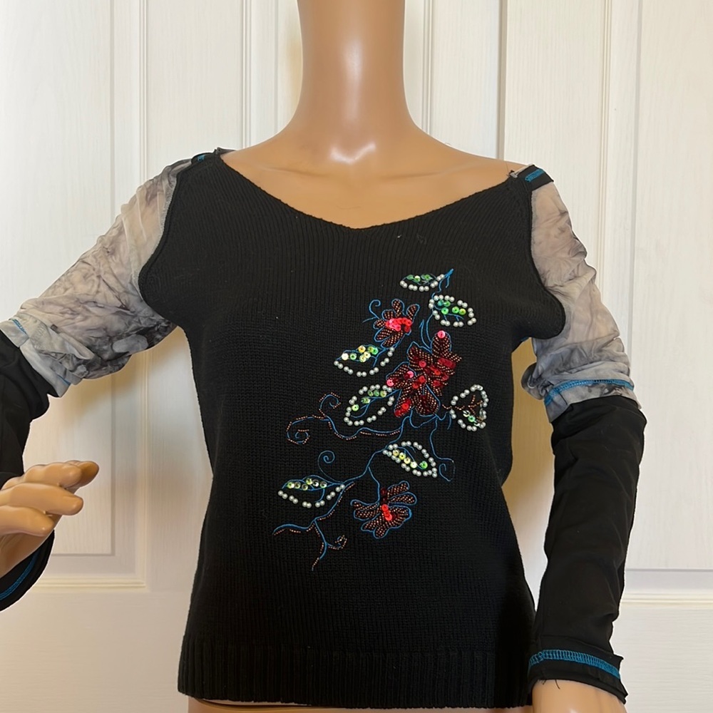 Mosquito sweater . Turquoise trim sheer sleeved to elbow floral sequin detail M